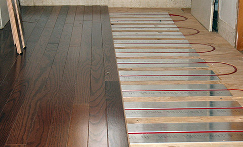 Hydronic heated floor being installed.